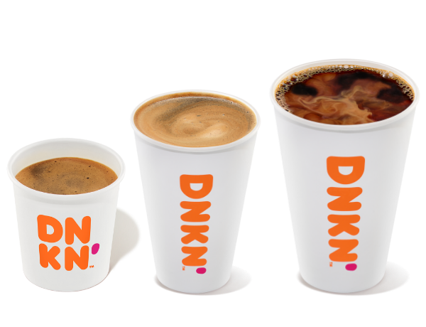 A cup of espresso next to a cup of hot chocolate and a cup of coffee